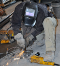 Employee working in the shop stirring lances